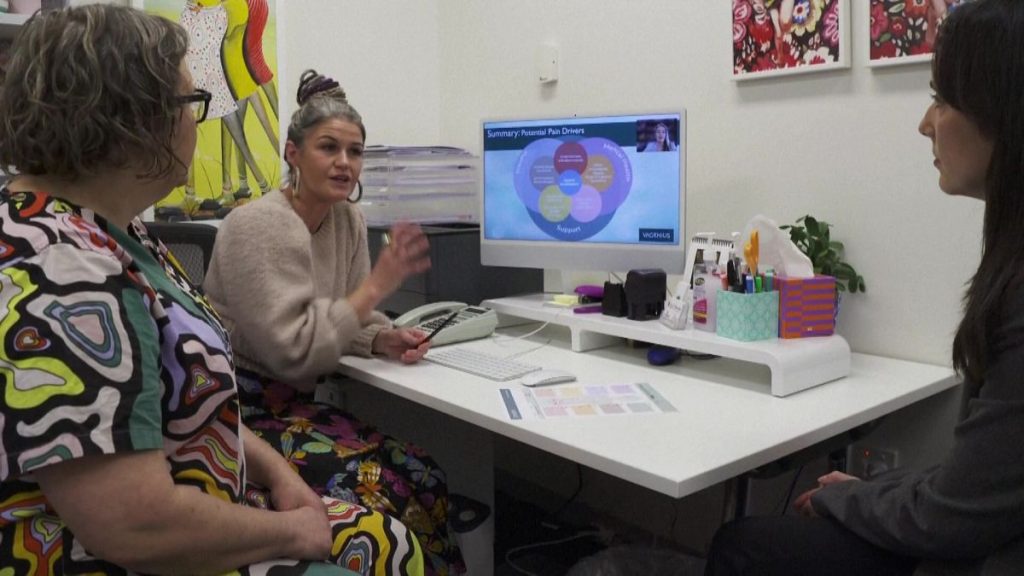 Emily Ware talking to Rachel Andrew and another woman