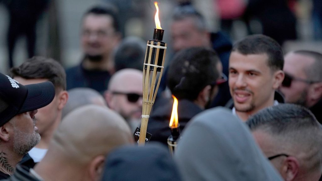 FILE: Supporters of the Portuguese nationalist movement 1143 light torches before staging a protest march under the slogan