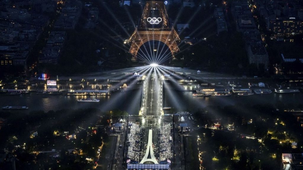 The Eiffel Tower and the Olympics rings we re lit up during the opening ceremony for the 2024 Summer Olympics.