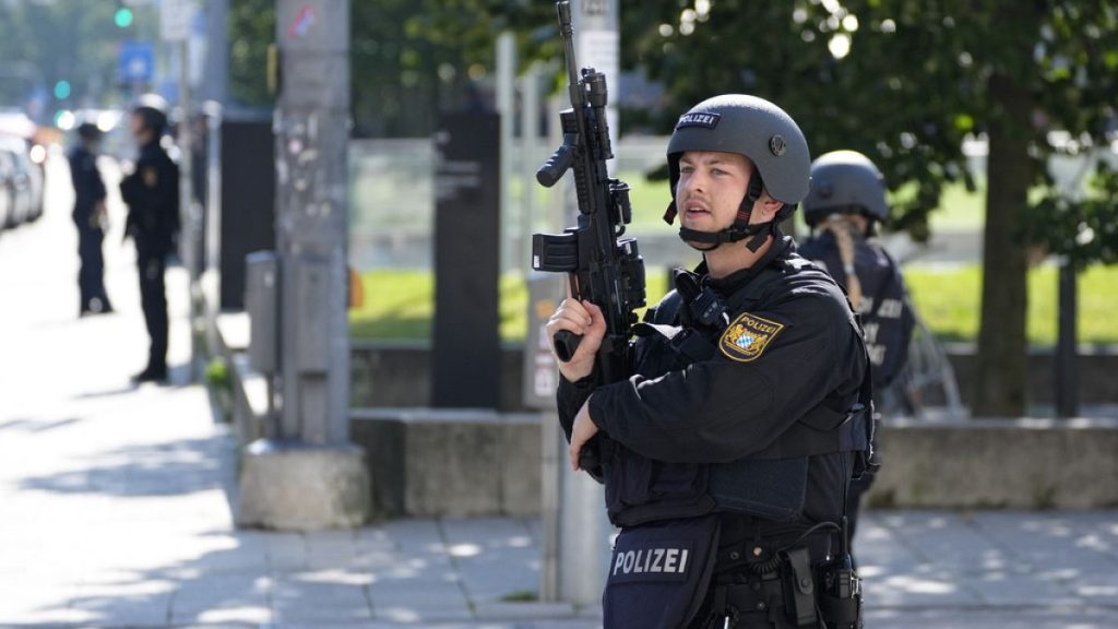 Police officers patrol near a scene after police fired shots at a suspicious person near the Israeli Consulate