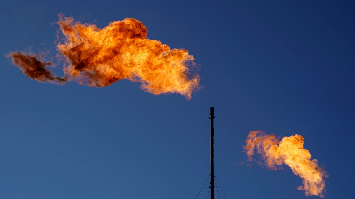 Flares burn off methane and other hydrocarbons at an oil and gas facility in Lenorah, Texas.