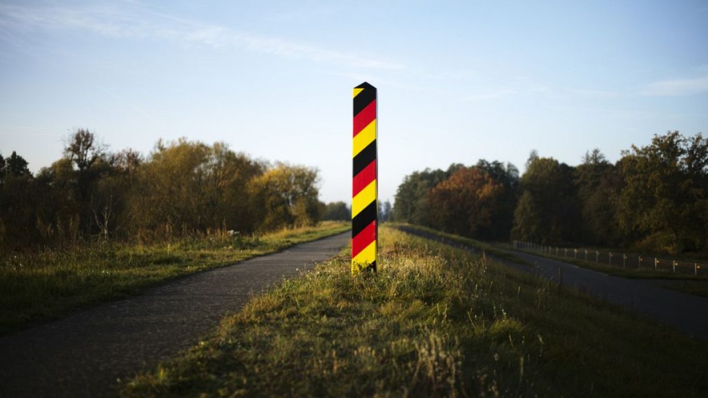 A border pole in German national colours marking the German border with Poland at the river Oder near the city Lebus, Germany, Oct. 28, 2021.