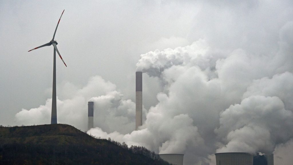 A wind turbine overlooks the coal-fired power station in Gelsenkirchen, Germany.