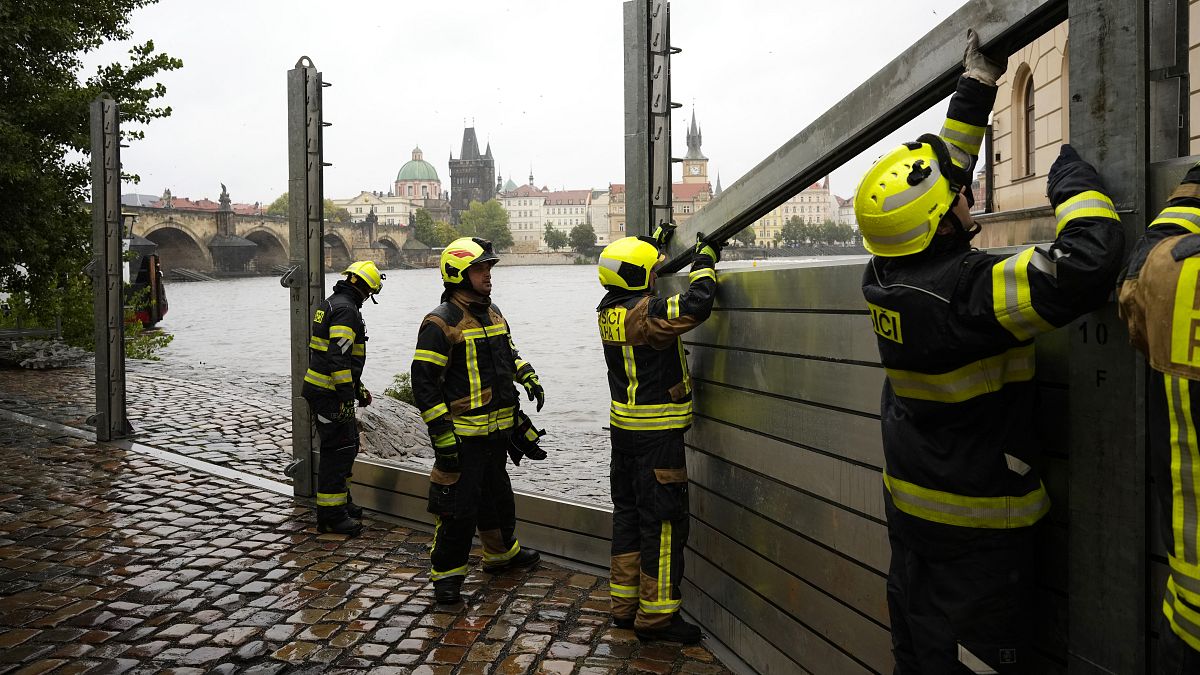 Firefighters adjust parts of the anti-flood barriers in Prague, September 13, 2024