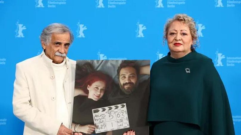 Esmael Mehrabi and Lily Farhadpour holding a picture of directors Maryam Moghaddam and Behtash Sanaeeha, who were banned from travelling to Berlin for the premiere