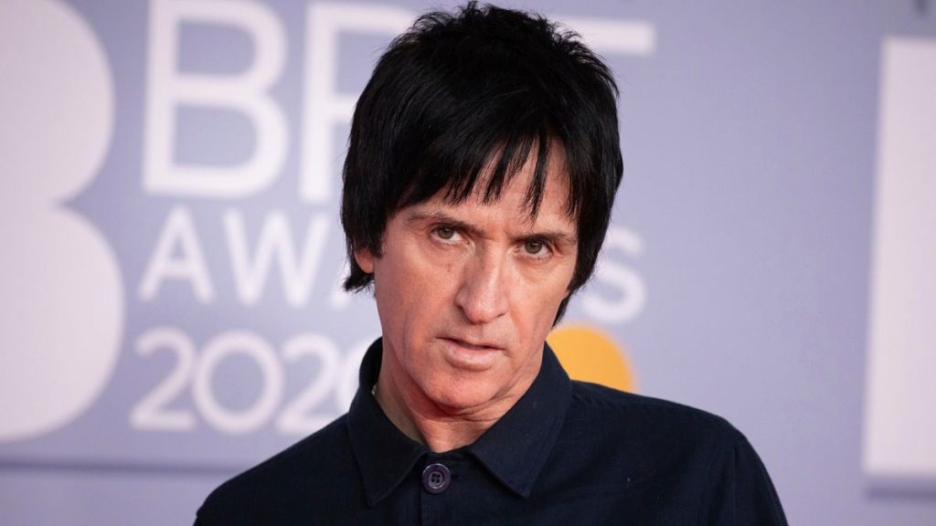 Johnny Marr poses for photographers upon arrival at Brit Awards 2020 in London, Tuesday, Feb. 18, 2020