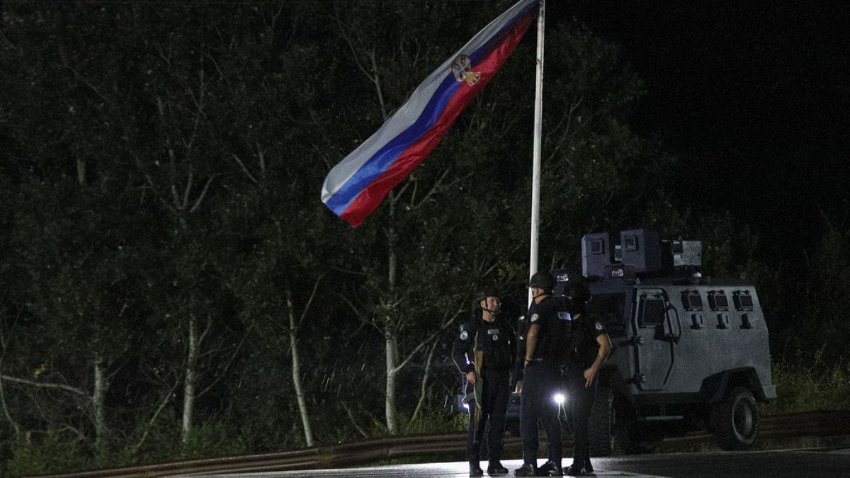 Kosovo police officers guard road near the village of Banjska, northern Kosovo, Sept. 24, 2023.