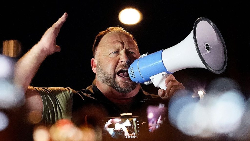 Infowars host and conspiracy theorist Alex Jones rallies Trump supporters in Phoenix, Arizona.