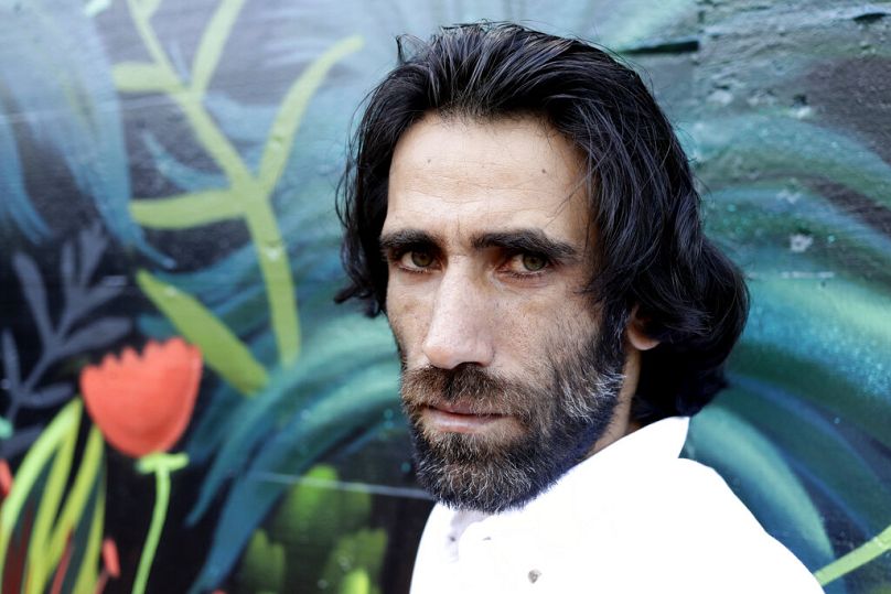 FILE - Behrouz Boochani poses for a portrait in Christchurch, New Zealand on 19 November, 2019.