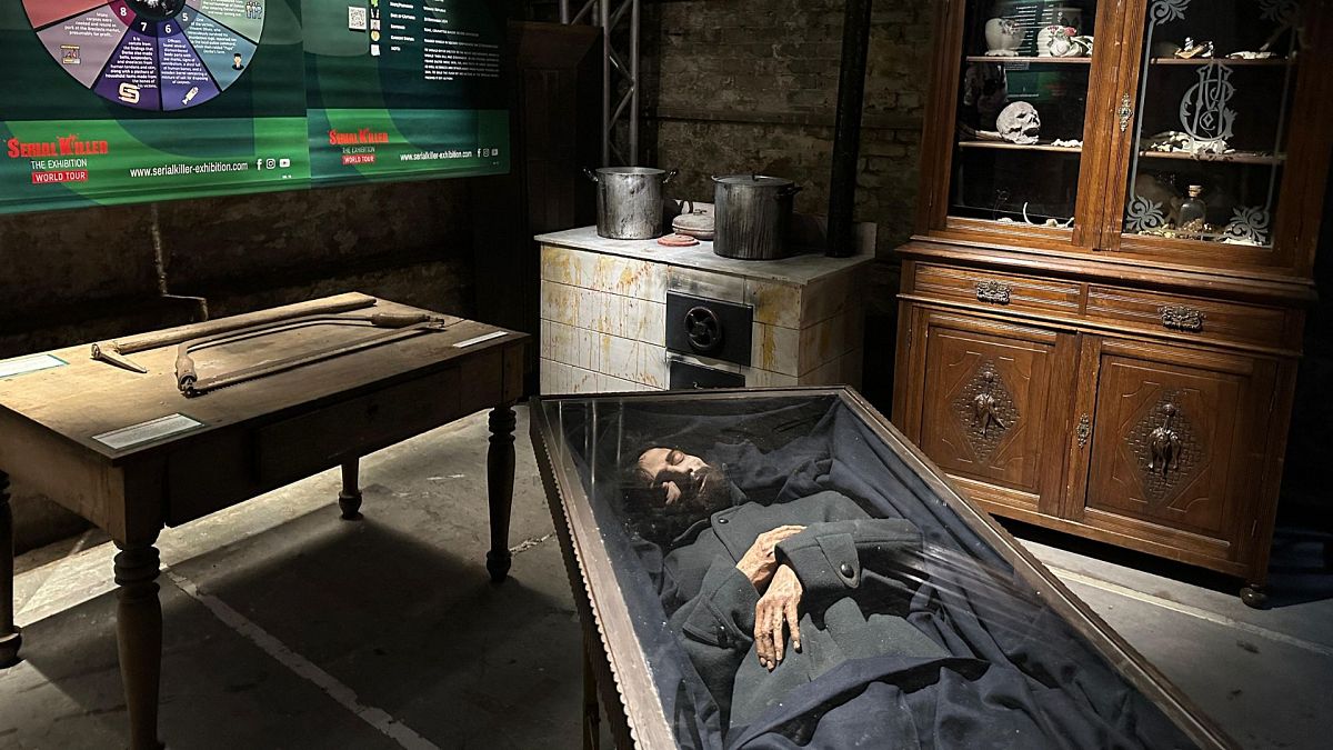 Reconstruction of the home of German serial killer Karl Denke and his body inside the coffin, as depicted in the only photograph of him.