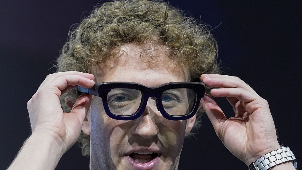 Mark Zuckerberg wears a pair of Orion AR glasses during the Meta Connect conference Wednesday, Sept. 25, 2024, in Menlo Park, Calif.