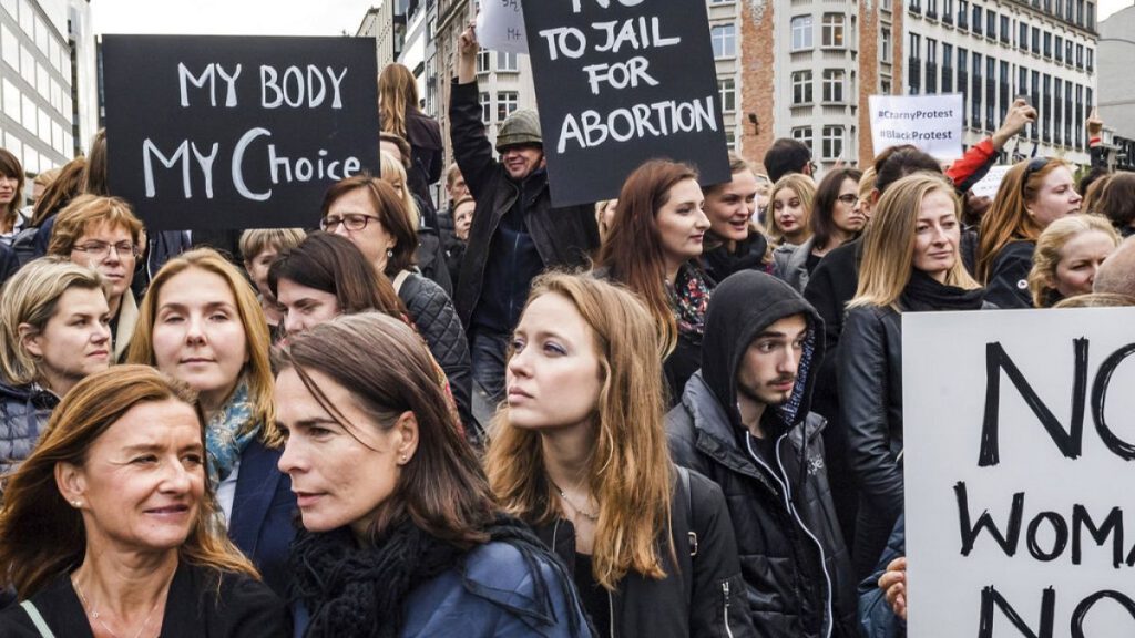 Polish women protest against a legislative proposal for a total ban on abortion in Poland, during a demonstration near EU headquarters in Brussels, Monday, Oct. 3, 2016.