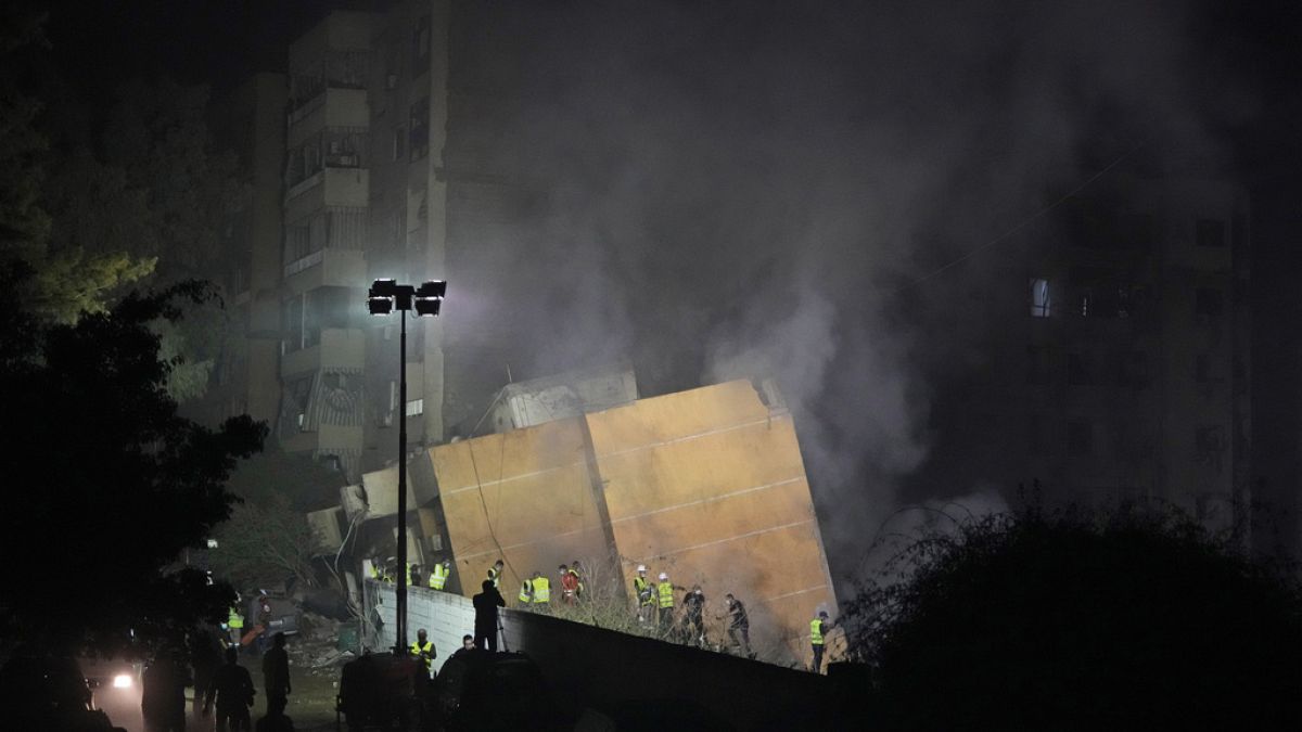 Rescuers arrive at the site of an Israeli airstrike in Beirut