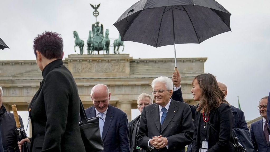 President of Italy Sergio Mattarella, second right, and Berlin mayor Kai Wegner, centre, stand in front of the Brandenburg Gate in Berlin, September 27, 2024