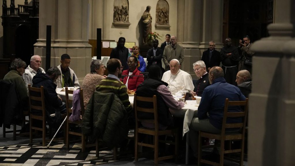 Pope Francis have a breakfast together with people who are experiencing homelessness and are assisted by the parish church of St. Gilles in Brussels, Saturday, Sept. 28, 2024.