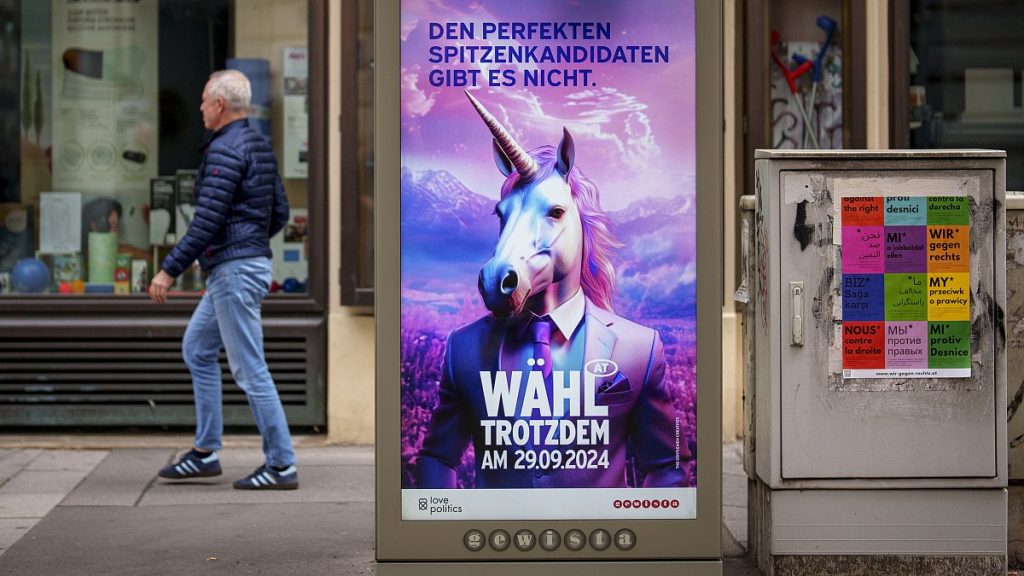 A man walks by a display bearing the message