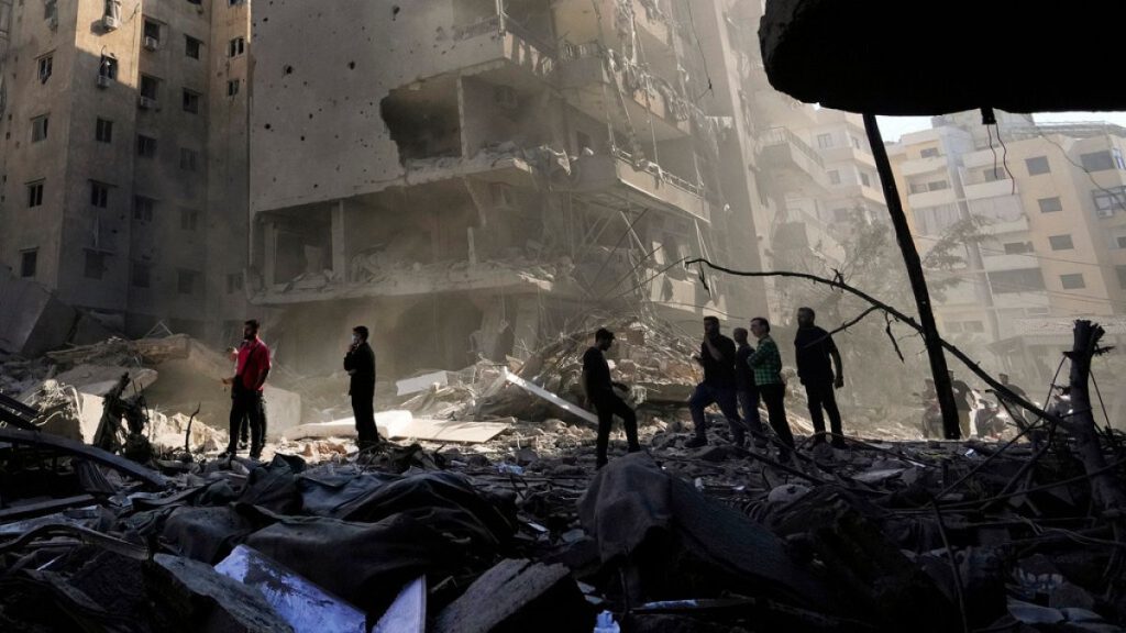 People check the site of the assassination of Hezbollah leader Hassan Nasrallah in Beirut