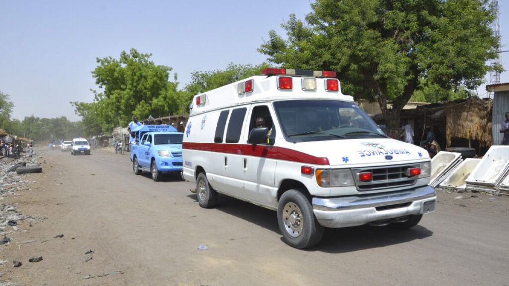 An ambulance and security cars drive to the site of a suicide bomb attack at a market in Maiduguri, Nigeria, Tuesday, June 2, 2015.