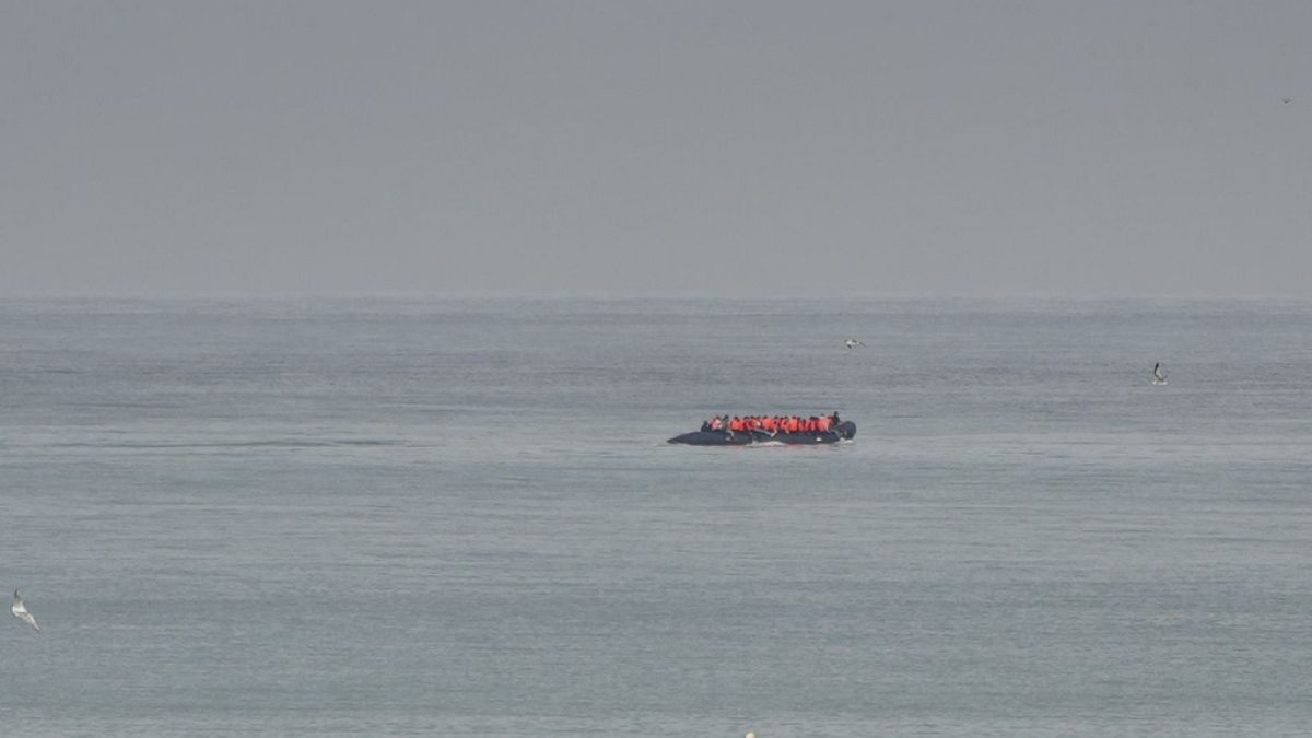 FILE - A boat thought to be with migrants is seen in the sea near the Wimereux beach, France, Wednesday, Sept. 4, 2024