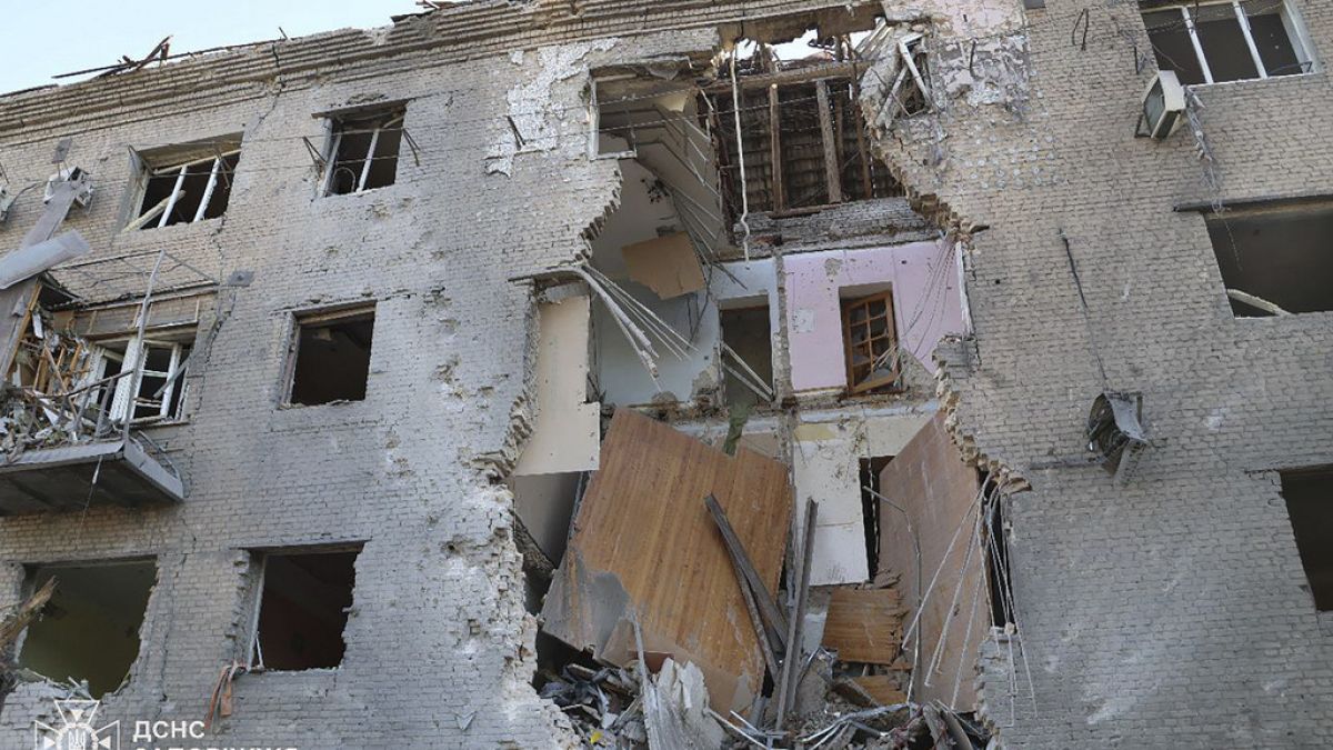 In this photo provided by the Ukrainian Emergency Service, a damaged apartment house is seen after Russia attacked the city with guided bombs overnight in Zaporizhzhia, Ukrain