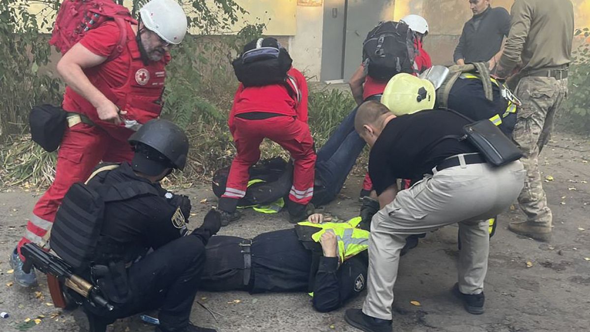 Emergency services help injured rescue worker after Russian attack on a medical centre in the northeastern Ukrainian city of Sumy Saturday, Sept. 28, 2024