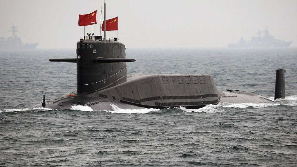 A Chinese Navy nuclear-powered submarine sails during an international fleet review in the waters off Qingdao