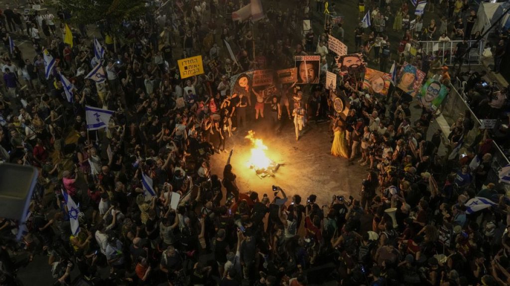 People protest against Prime Minister Benjamin Netanyahu