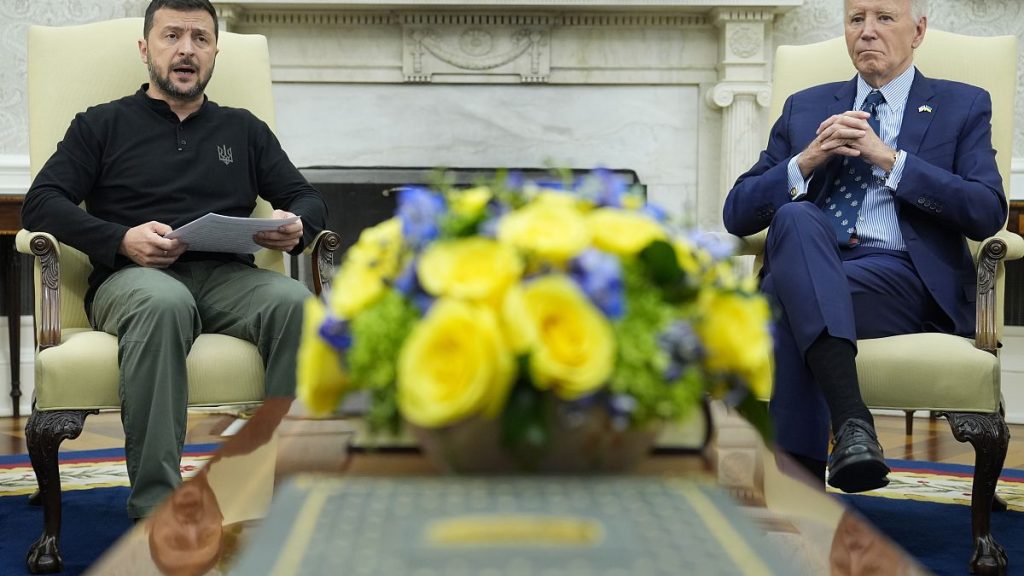 President Joe Biden, right, listens as Ukraine