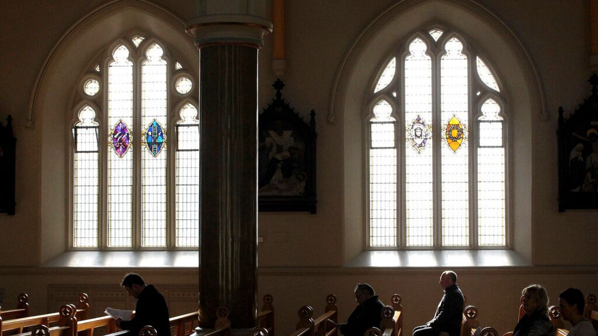 In this March 21, 2010 file phtoo, Roman Catholics listen during mass at St. Peter