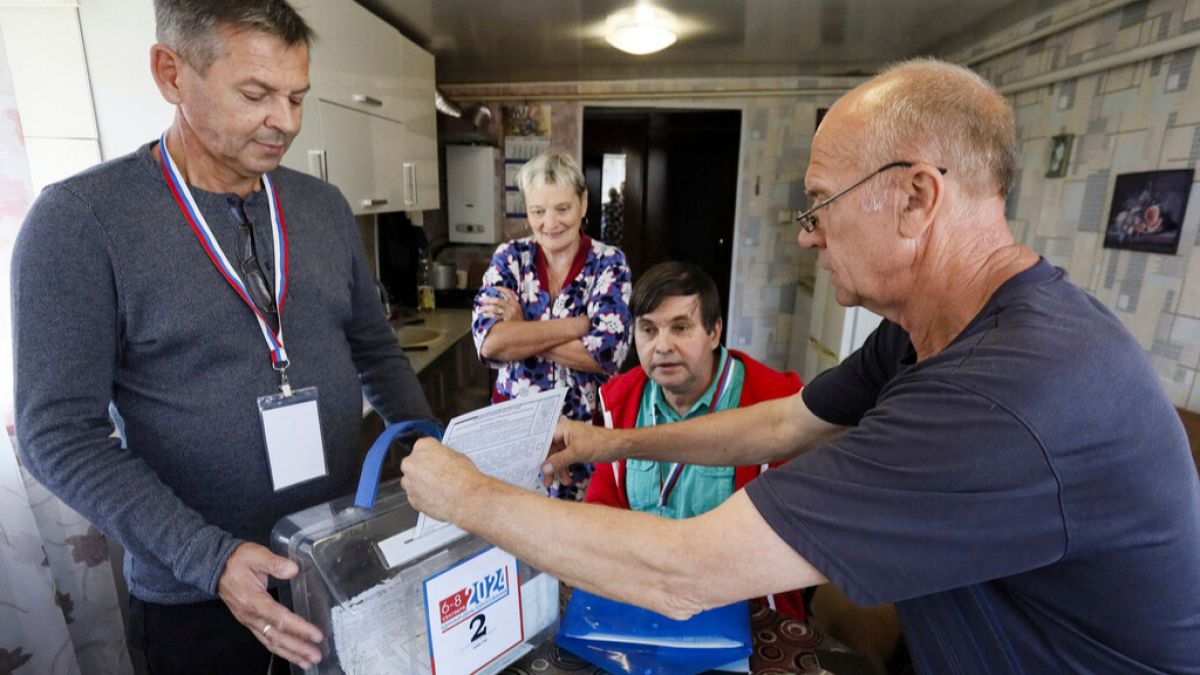 A man casts his ballot at his home in the Zheleznodorozhny district of Kursk, Russia, on Saturday, Sept. 7, 2024, during the three-day all Russia regional elections.