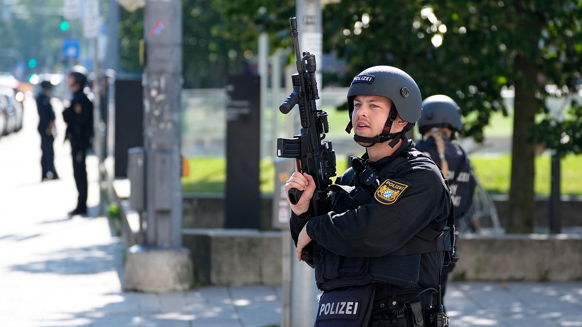 Police officers patrol near a scene after police fired shots at a suspicious person in Munich, Germany, Thursday, Sept. 5, 2024.