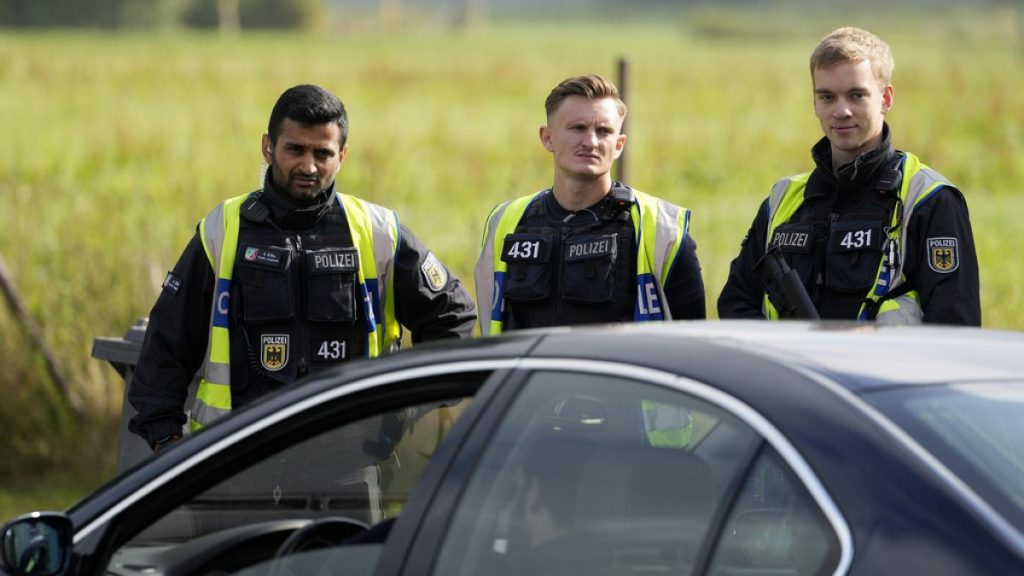 German police check the details of a French car near the border to Belgium in Aachen, Germany, Monday, Sept. 16, 2024.