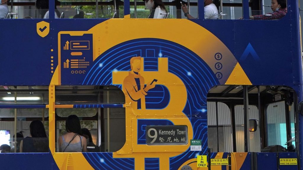 Library picture of an advertisement for Bitcoin on a tram in Hong Kong