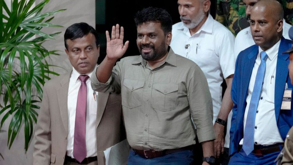 Anura Kumara Dissanayake waves as he departs the election commission office after winning the presidential election in Colombo, Sri Lanka, Sunday, Sept. 22, 2024.