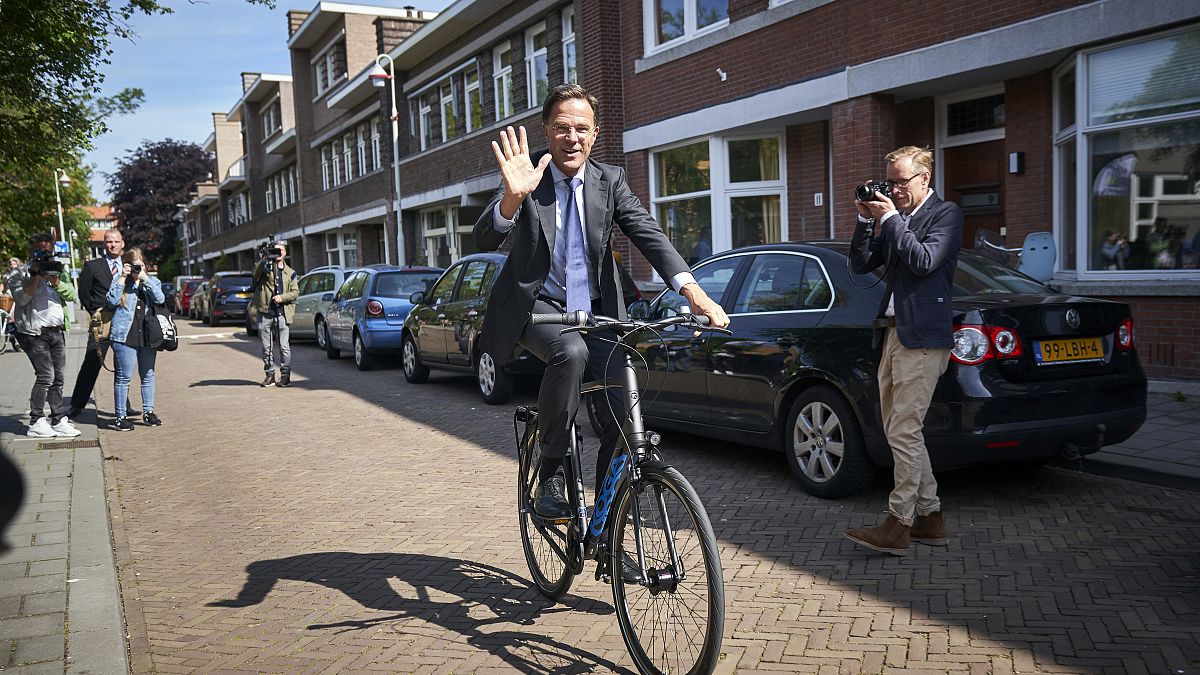 Mark Rutte on his bicycle after voting in 2019 EU elections