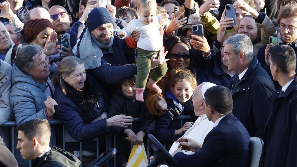 Pope Francis cheers faithful at the end of his meeting with students of the Louvain Catholic University in Ottignies-Louvain-la-Neuve, Belgium, Saturday, Sept. 28, 2024.