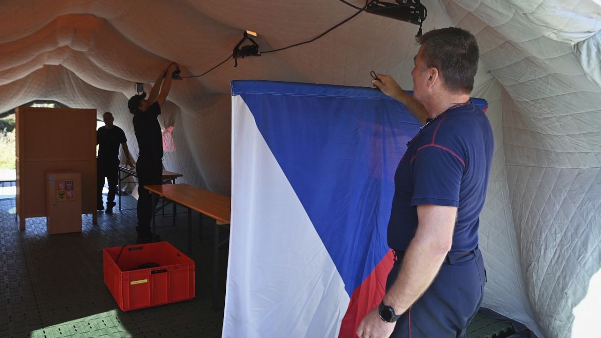 Firefighters set up an improvised polling station for a two-day vote for one-third of the seats in Parliament’s upper house, the Senate