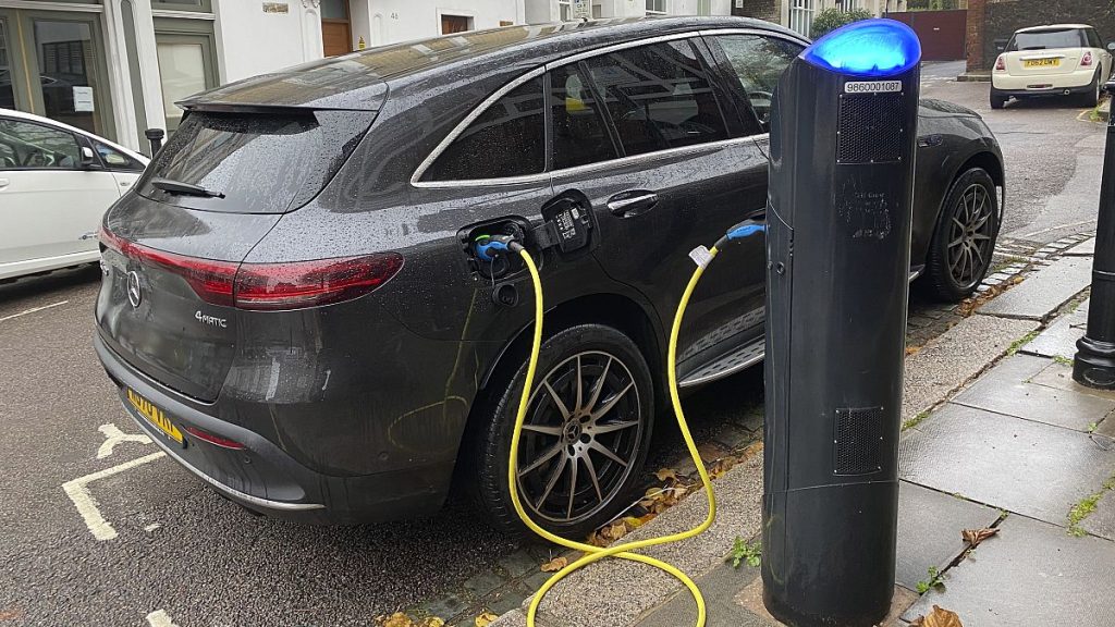 An electric vehicle charges at a public fast-charging station in London on Oct. 20, 2022.