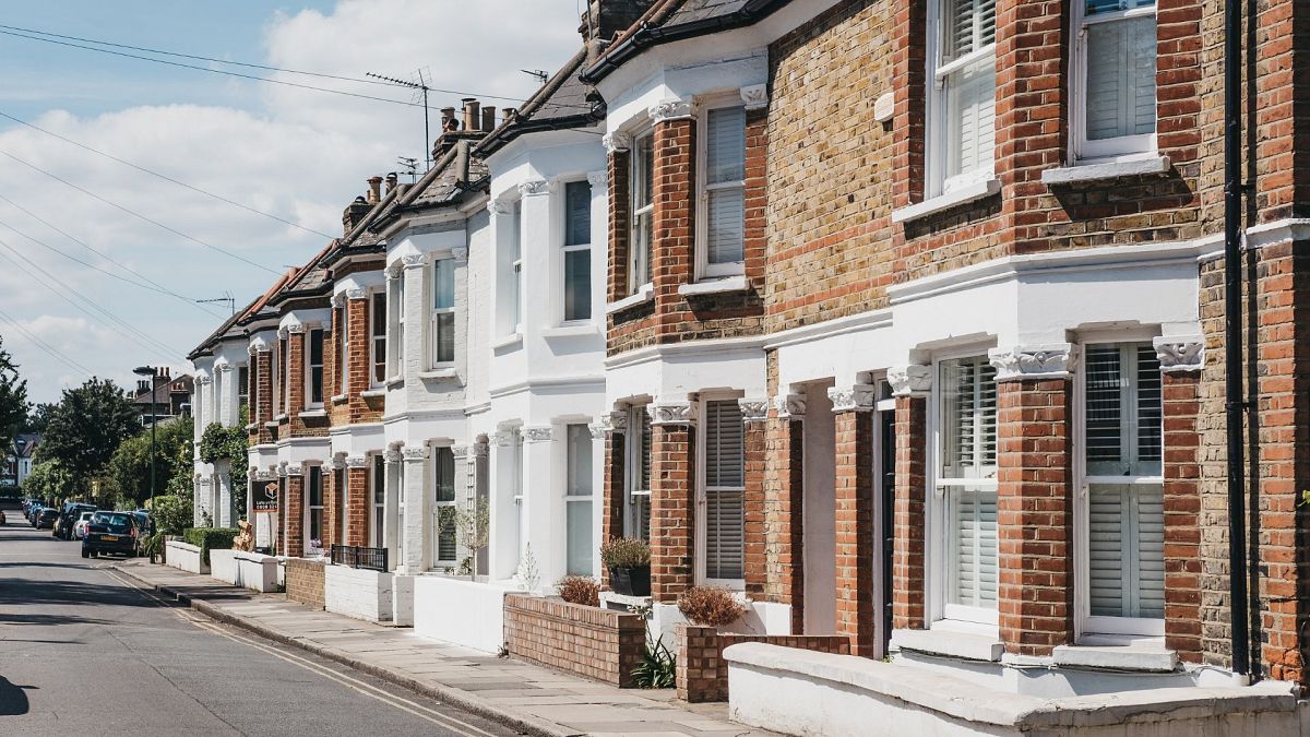 Row of typical British terraced houses in Barnes, an affluent residential area of London, famous for its village atomosphere.