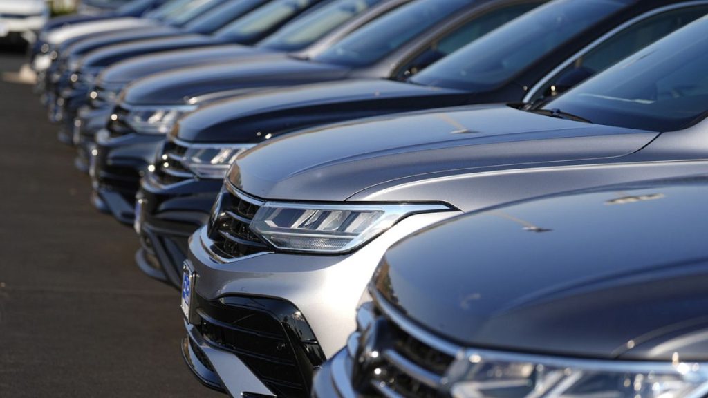 A long row of unsold 2024 Tiguan utility vehicles are shown Sunday, July 28, 2024, at a Volkswagen dealership in Denver.