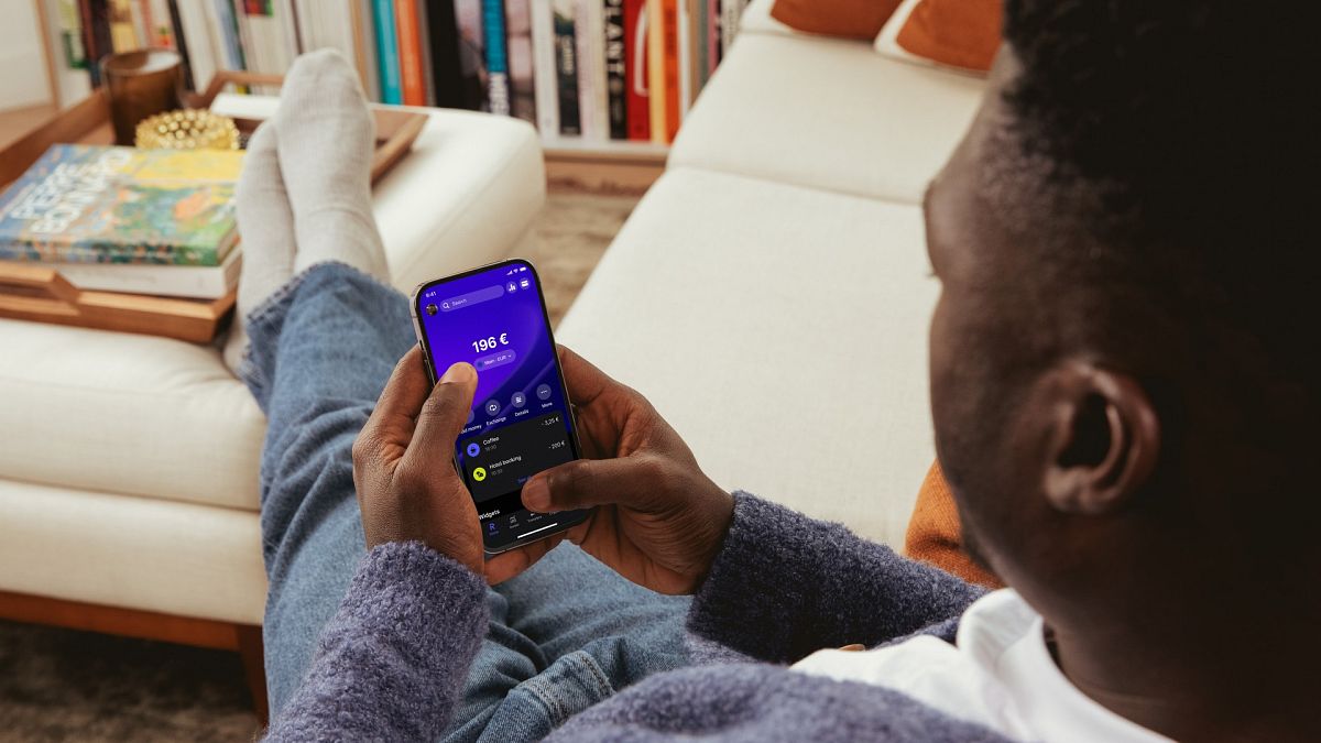 A man using the Revolut app