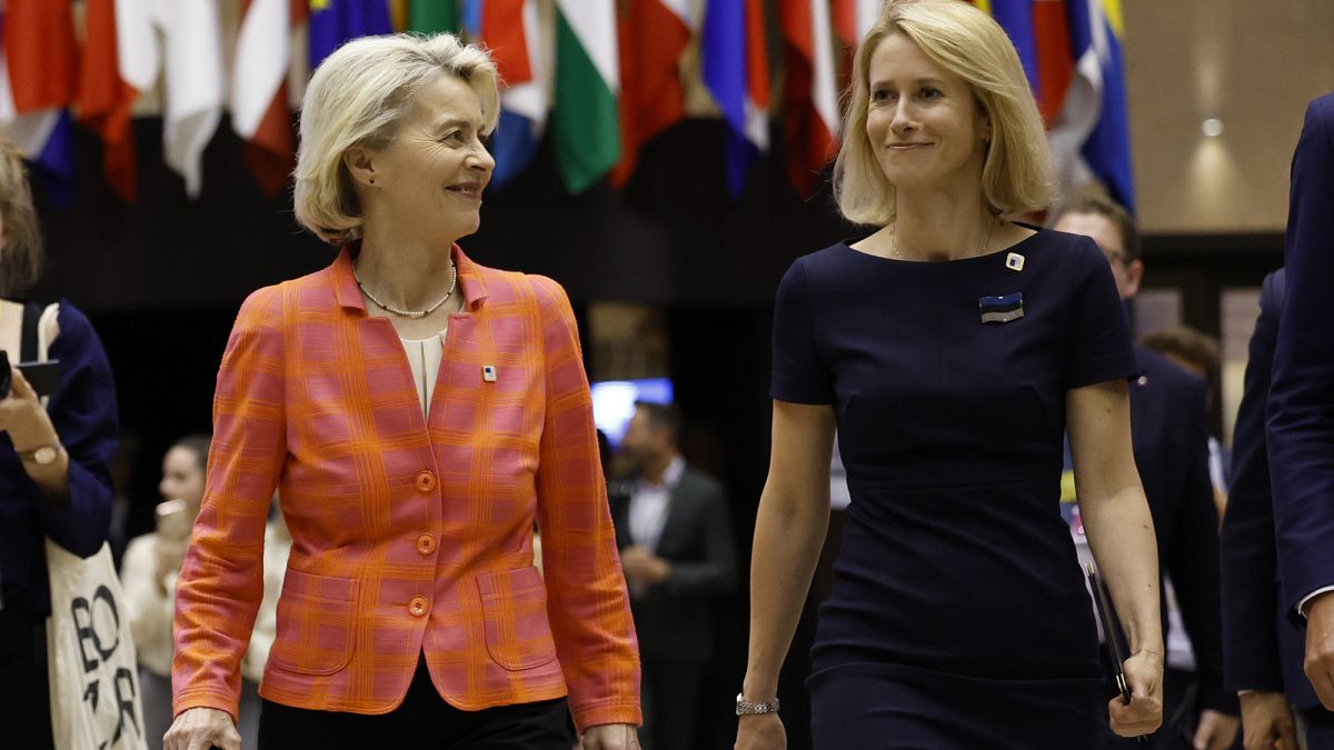 European Commission President Ursula von der Leyen and former Estonian Prime Minister Kaja Kallas walk together to a media conference during an EU summit in Brussels