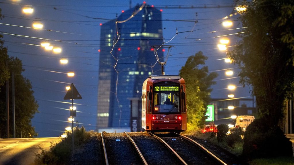 A tram drives towards the European Central Bank in Frankfurt