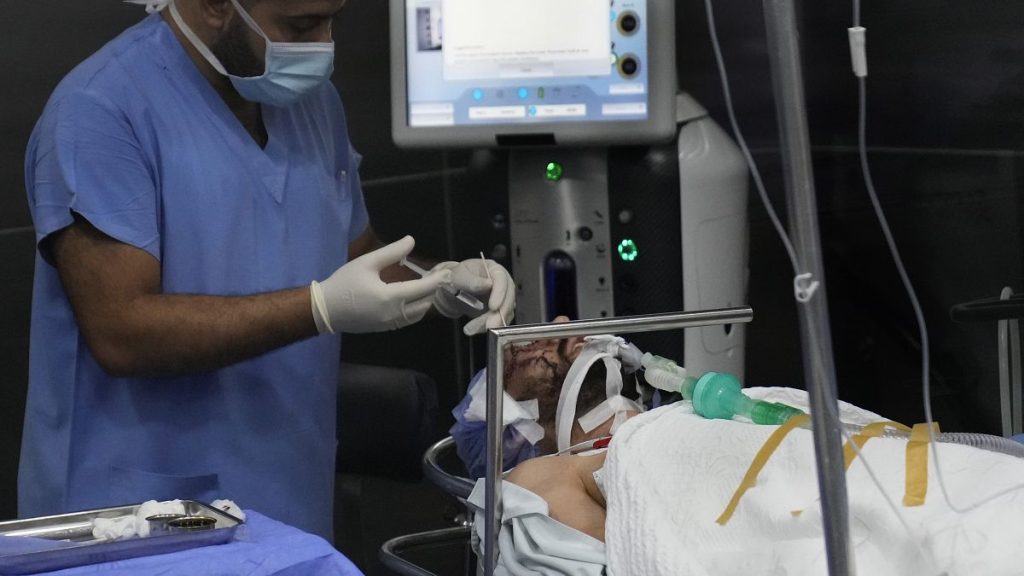 A man who was injured in the explosion of one of the handheld devices, lies inside an operation room ahead of an eye surgery at the Eye Specialist hospital, in Beirut, Lebanon