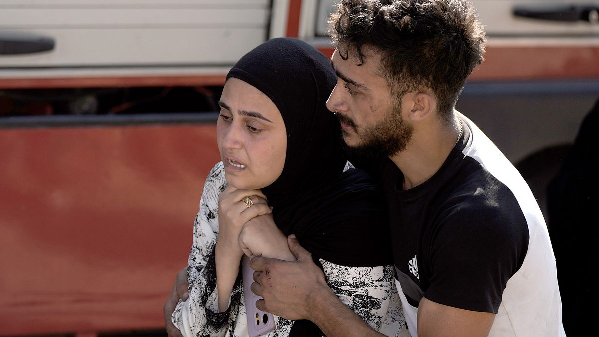 A woman reacts at the scene of an Israeli airstrike in the town of Maisara, north of Beirut, 25 September 2024