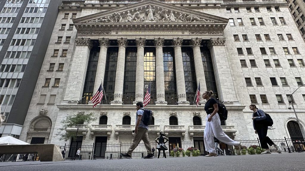 People pass the New York Stock Exchange on Wednesday, Sept. 4, 2024, in New York