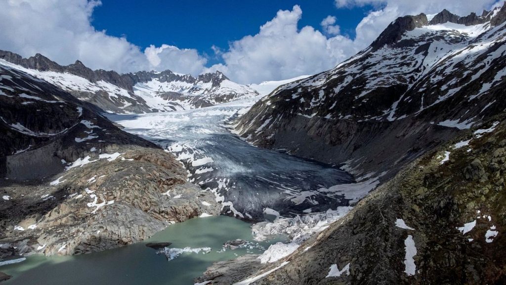 A lake of meltwater has formed on the tongue of the Rhone Glacier near Goms, Switzerland, 13 June 2023.