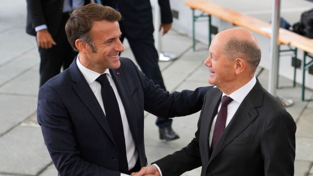 German Chancellor Olaf Scholz, right, welcomes French President Emmanuel Macron for a meeting at the chancellery in Berlin, Germany, Wednesday, Oct. 2, 2024.