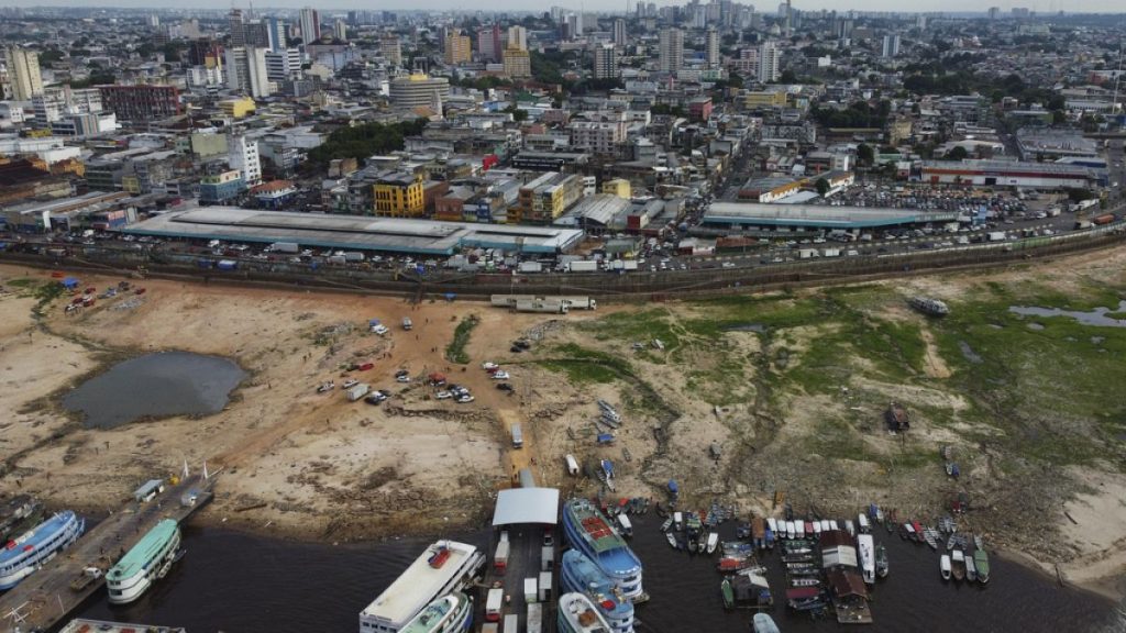 The earth is exposed along the Negro River at the port in Manaus, Amazonas state, Brazil, Friday, Oct. 4, 2024, amid severe drought.