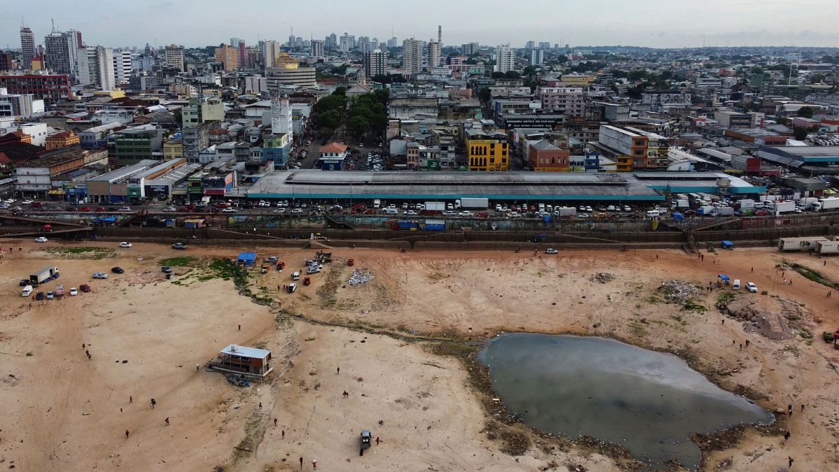 A part of the Negro River is dry at the port in Manaus, Amazonas state, Brazil, 4 October 2024, amid severe drought.